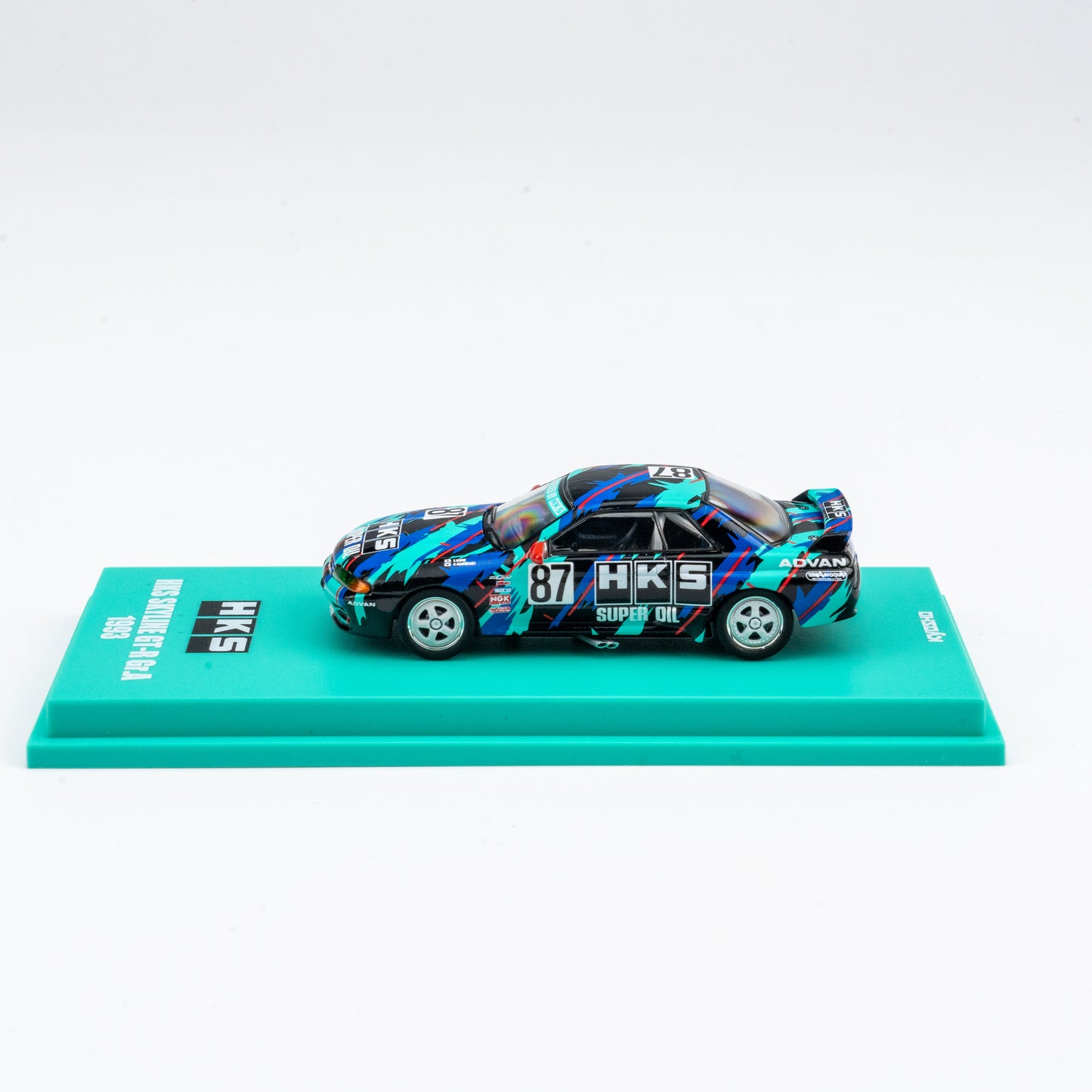 (Preorder) Kyosho 1:64 Nissan Skyline GT-R HKS #87 - Includes Mini Car & Book