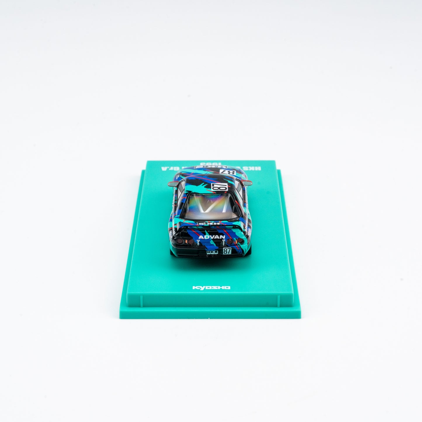 (Preorder) Kyosho 1:64 Nissan Skyline GT-R HKS #87 - Includes Mini Car & Book