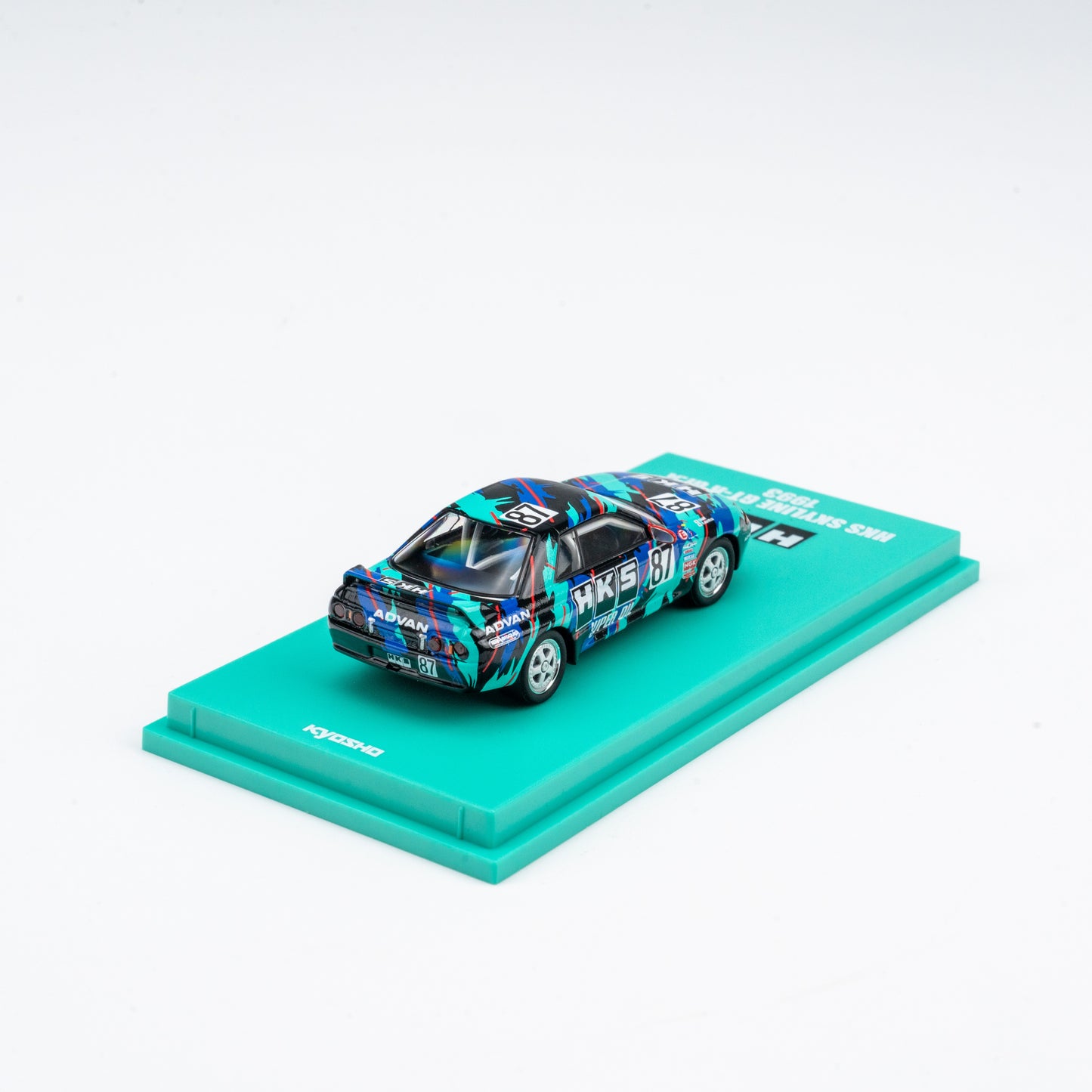 (Preorder) Kyosho 1:64 Nissan Skyline GT-R HKS #87 - Includes Mini Car & Book