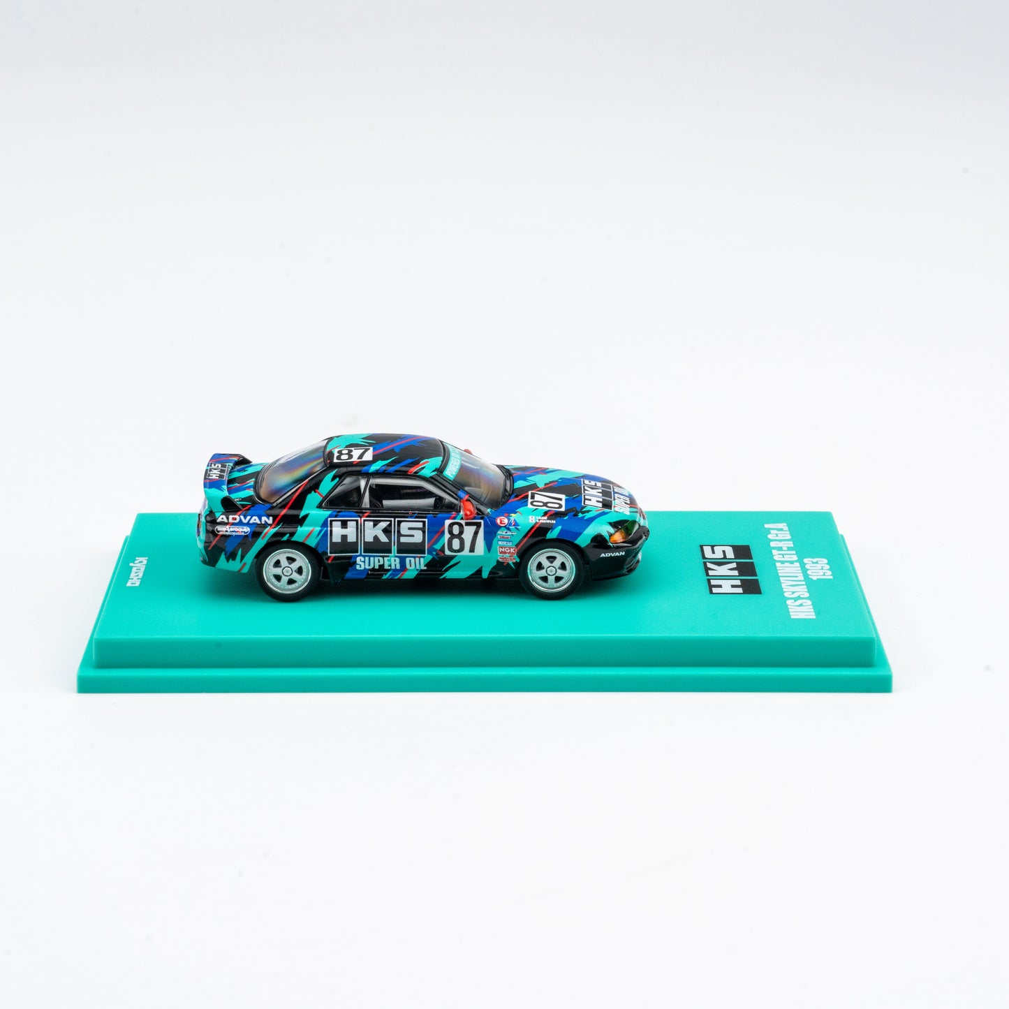 (Preorder) Kyosho 1:64 Nissan Skyline GT-R HKS #87 - Includes Mini Car & Book