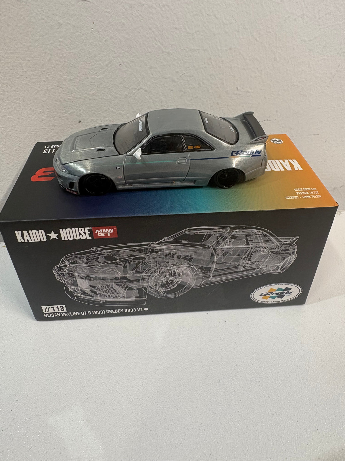 Kaido House x Mini GT 1:64  Nissan Skyline GT-R (R33) Greddy GR33 - Chase Car